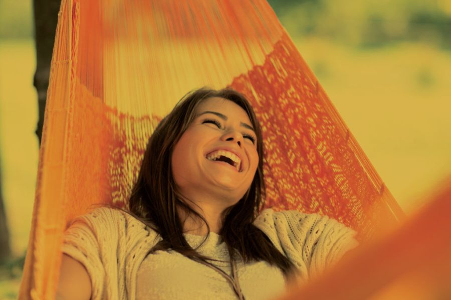 woman in hammock laughing
